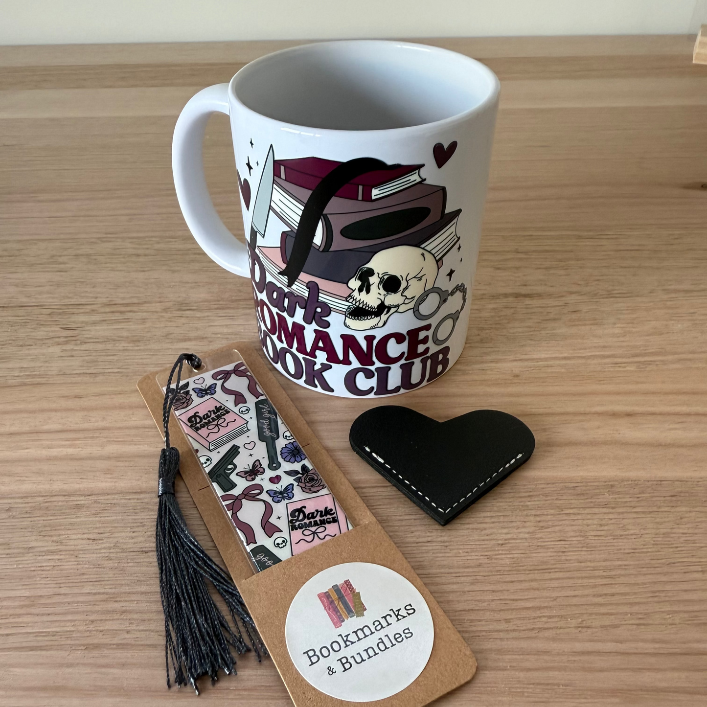 Mug with 'Dark Romance Book Club' design, bookmark, and heart-shaped leather bookmark